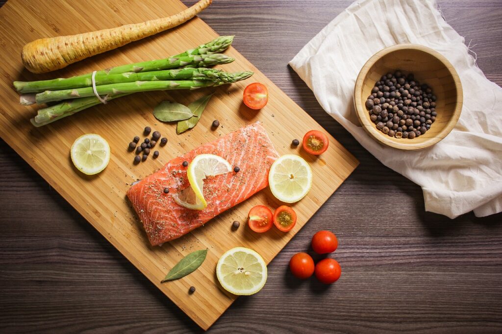 Salmon and vegetables on a cutting board